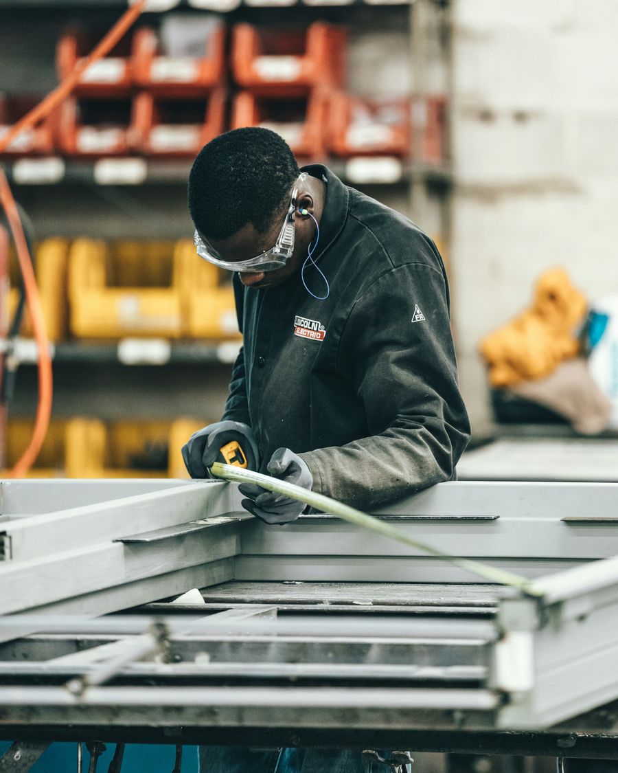 Worker installing an aluminium glass panel